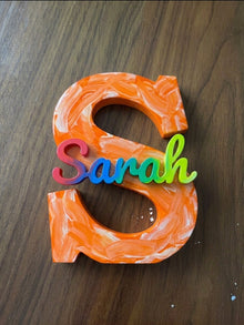 Painted name sign reading Sarah