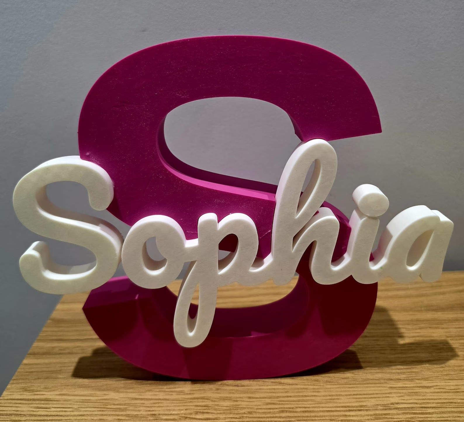 Pink and white painted name sign